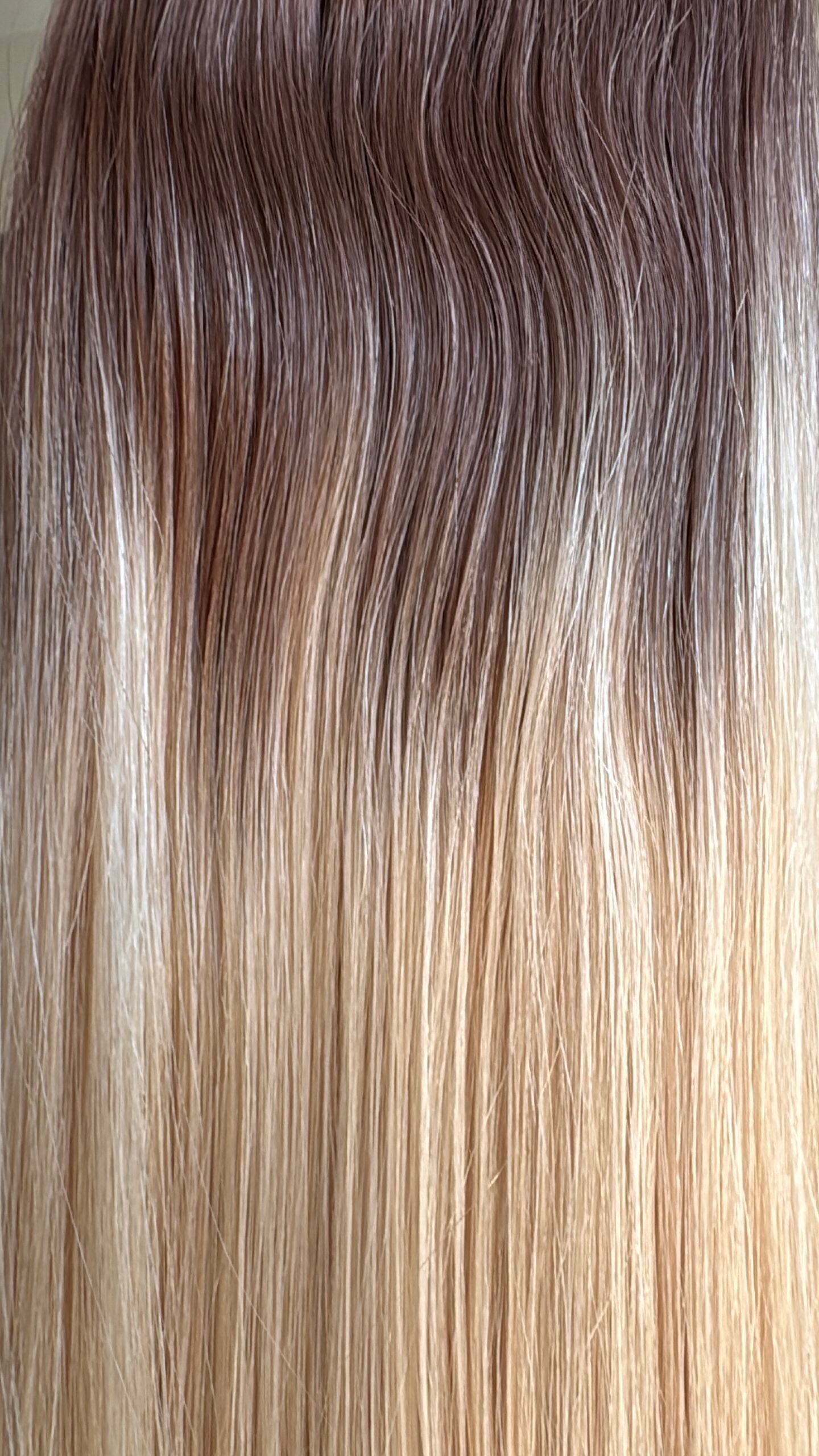 Close-up of brown to blonde hair extensions