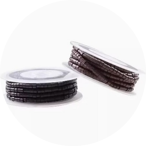 Two spools of black and brown beaded cord on a white background