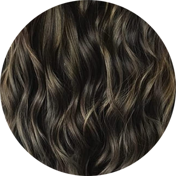 Close-up of wavy brown hair on a white background