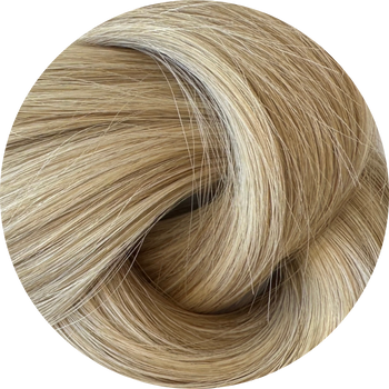 Close-up of blonde hair with a gradient from dark to light.