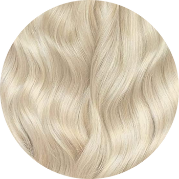 Close-up of wavy blonde hair on a white background