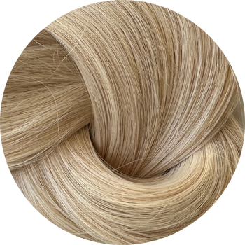Close-up of blonde hair extensions on a white background