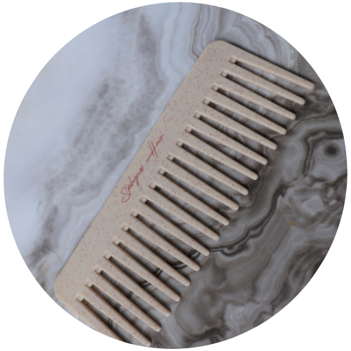 Beige comb on a marble surface