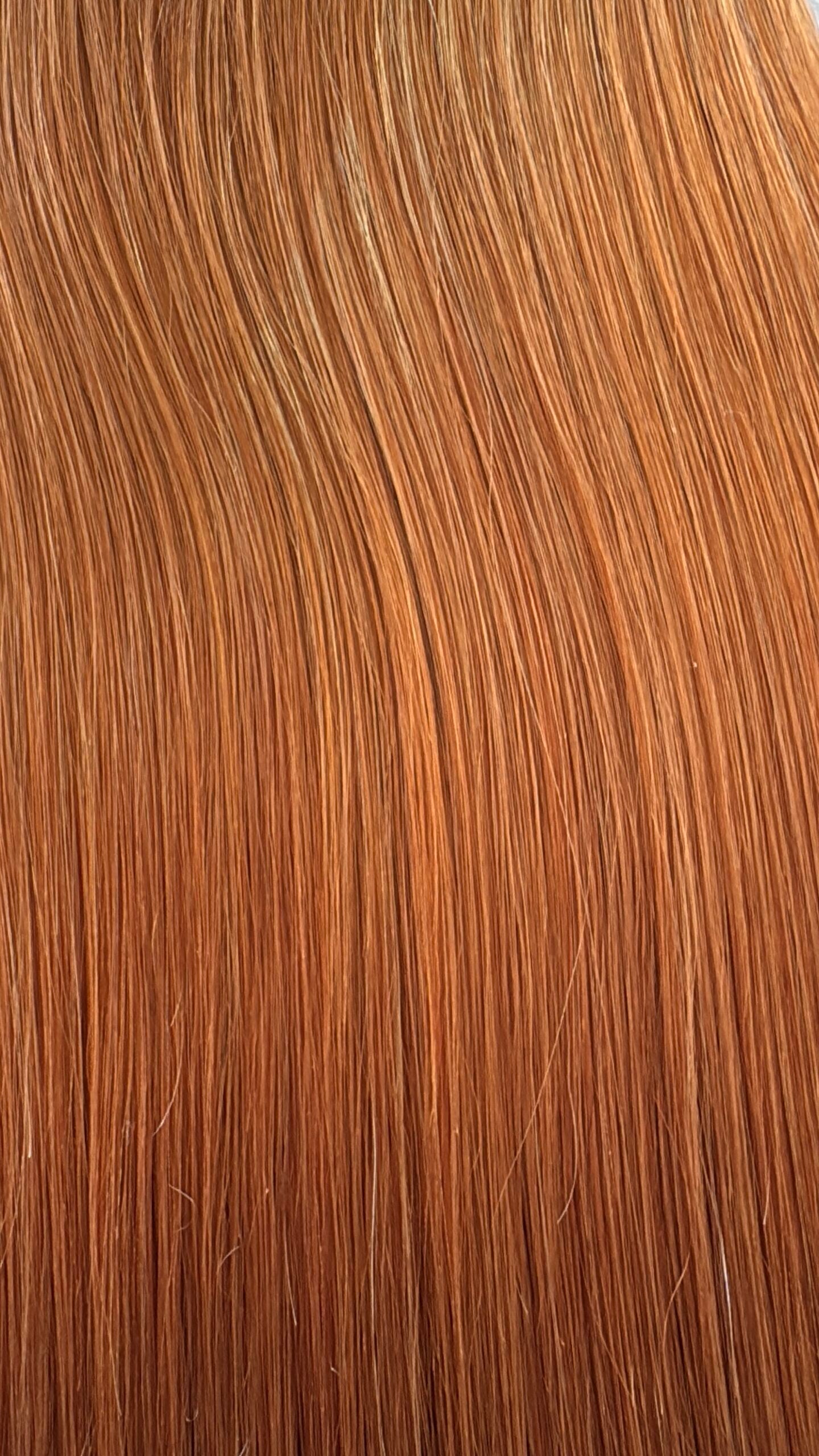 Close-up of red hair extensions