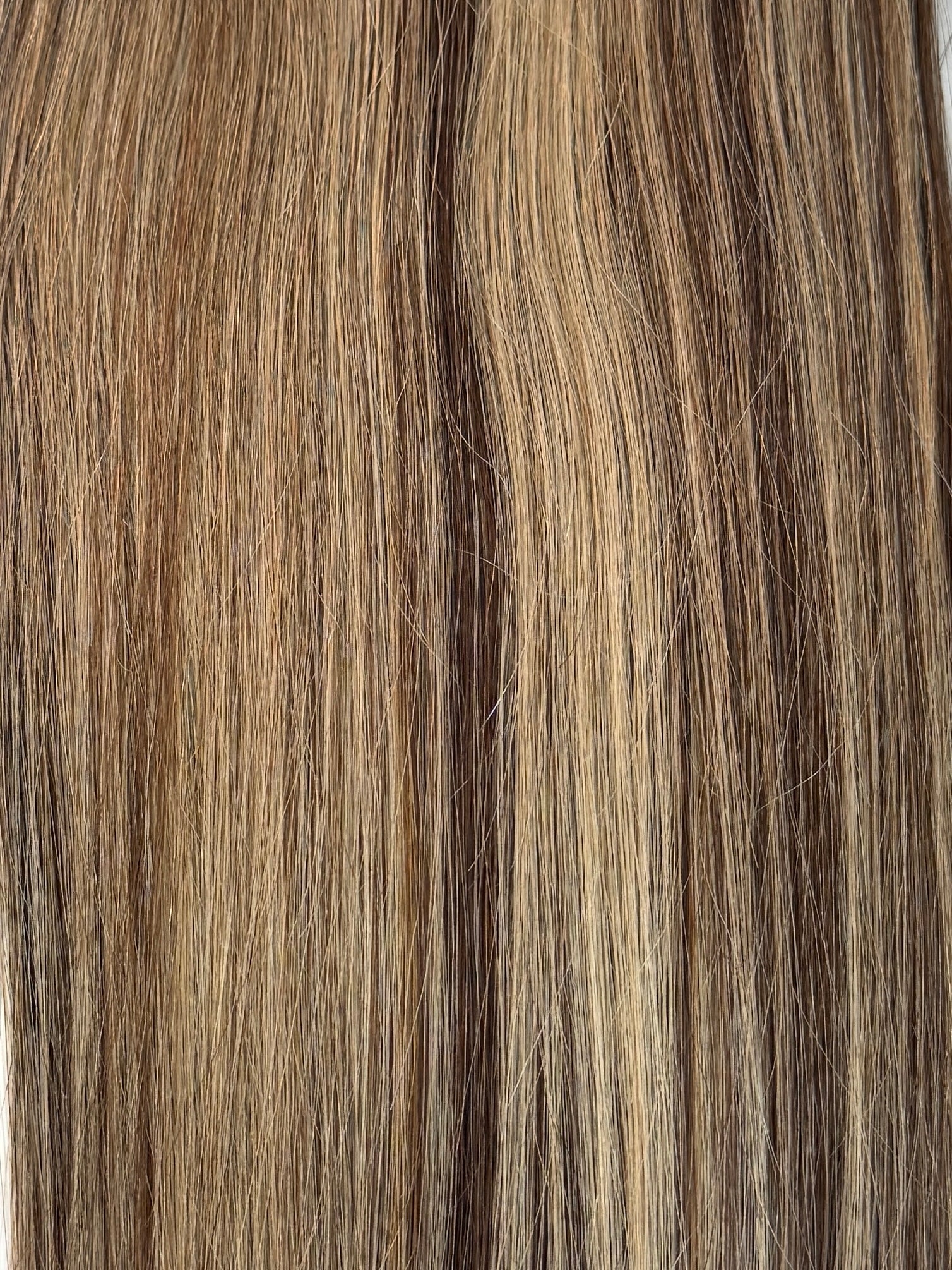 Close-up of brown and blonde hair extensions