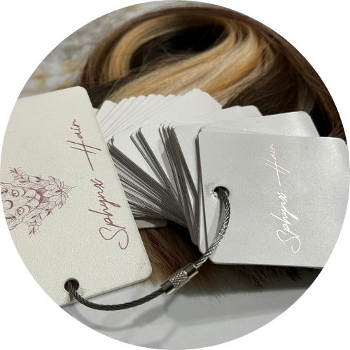 Hair extensions with branded tags on a white background