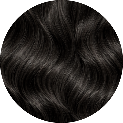 Close-up of dark hair extension swatch with a circular border