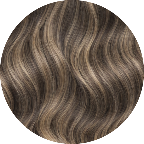 Close-up of wavy hair with brown and blonde coloration on a white background