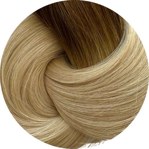Close-up of a coil of blonde hair extensions on a white background