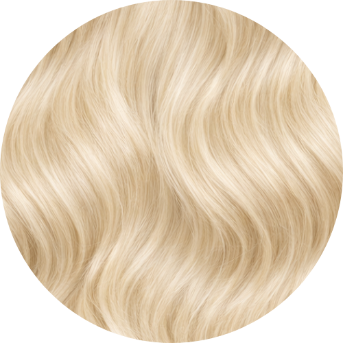 Close-up of blonde hair with a wavy texture on a white background